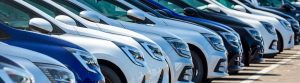 A row of different coloured fleet vehicles